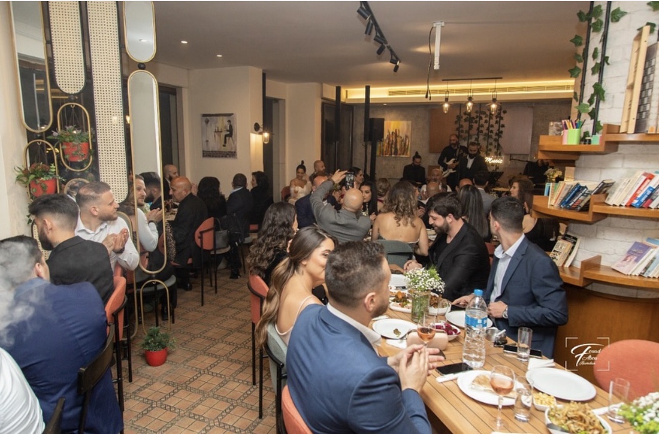 A full dining room at Beit Setelkel during a private celebration